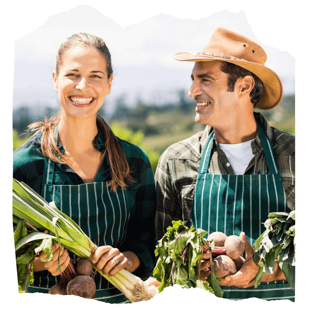 Predator Guard Two smiling farmers wearing striped aprons holding harvested vegetables